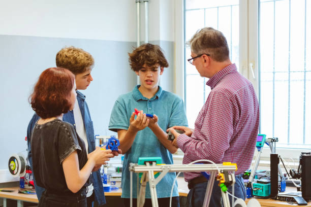 istock High school students talking with teacher over 3d printer in the classroom 1695355266