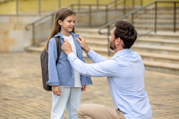 istock Dad taking his daughter to school 1695371732