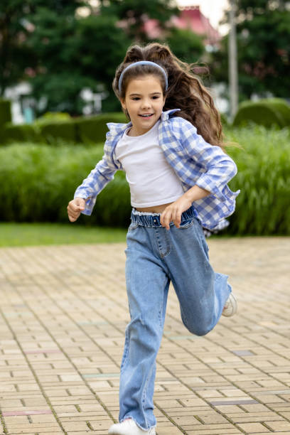 istock Happy kid running at the school yard 1695372279