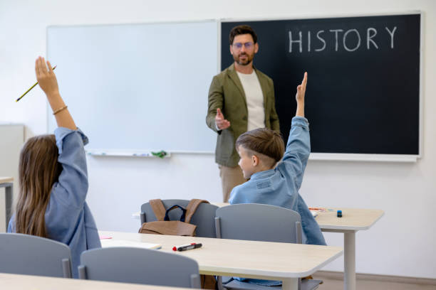 istock Kids at the lesson looking involved and interested 1695372283