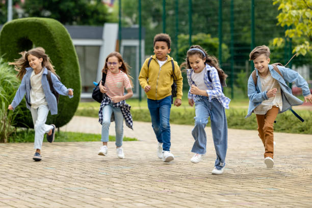 istock Happy kids running at the school yard 1695372285