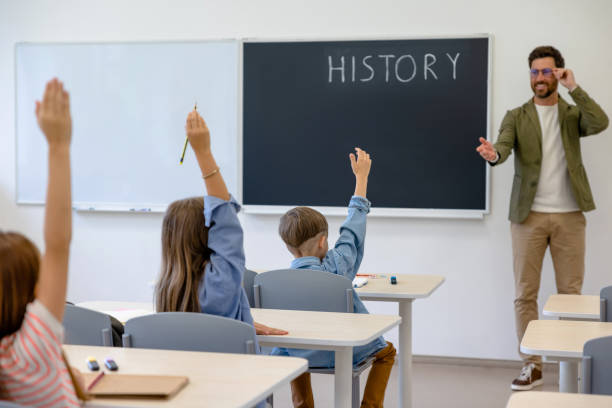 istock Kids at the lesson looking involved and interested 1695372310