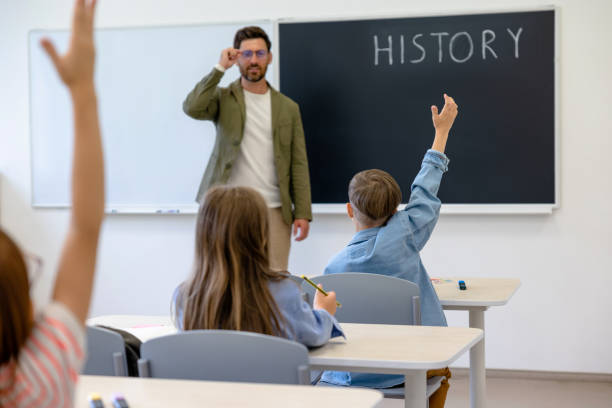 istock Kids at the lesson looking involved and interested 1695372320