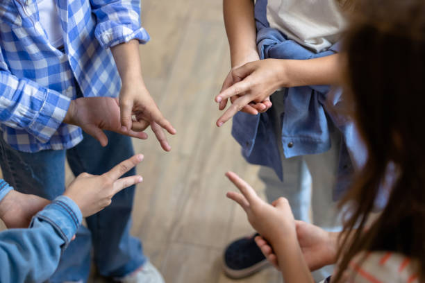 istock Kids playing finger game at break at school 1695373398