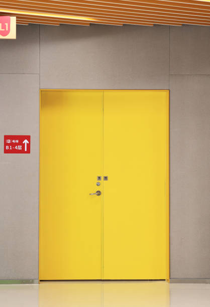 istock Interior of office building with yellow wall 1695376109