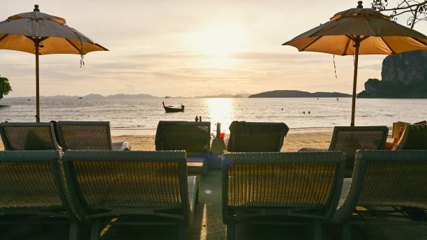 istock Wide angle view natural view with deck chairs on a sunny sandy beach at Phranang railay island krabi thailand 1695378966