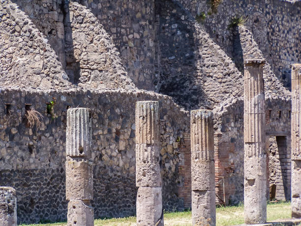Carved pillars inside the amphitheatre at Pompeii, Italy