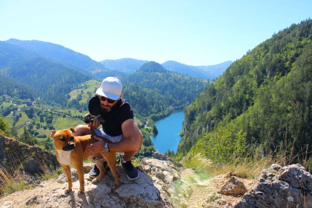 istock Man and his dog traveling 1695400551
