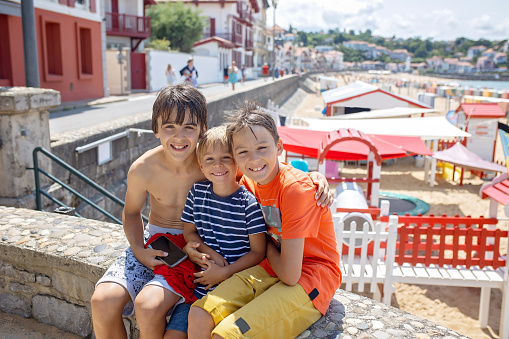 Family, visiting small town in France, Saint Jean de Luz, during summer vacation, traveling with children in Europe