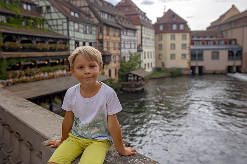 Beautiful family with children, boys, visiting Strasbourg in France during summer vacation