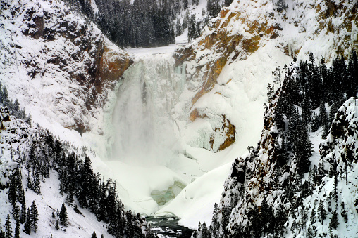 Upper Yellowstone Falls in Winter covered in heavy snow