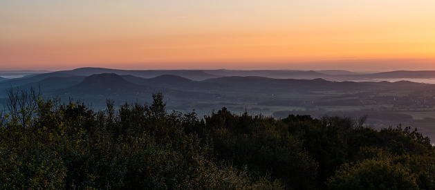 Panoramic picture of the Balaton Uplands with morning fog at sunrise