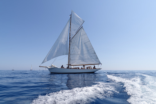 Imperia, Italy - September 10, 2023: Sail yacht the old style, during regatta in Gulf of Imperia. Established in 1986, the Imperia Vintage Yacht Challenge Stage is a of the most important event in sailing the Mediterranean dedicated to historical boats
