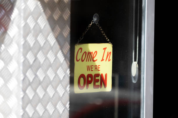 istock Store opened sign hanging on the window. 1695471004