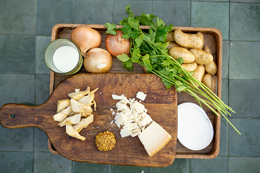 Top view on healthy food ingredients for cooking on tiled green table outdoors