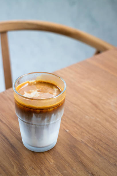 istock Dirty coffee on wooden table 1695485147