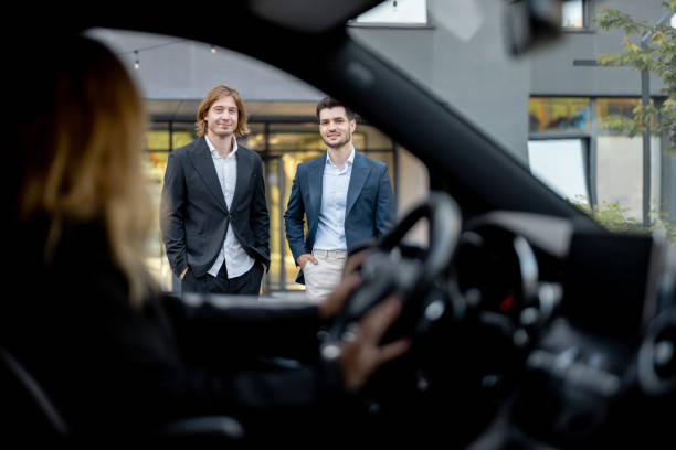istock Two businessmen walk to the car from a building 1695491930
