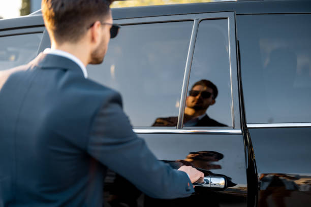 istock Businessman opening vehicle door 1695494048