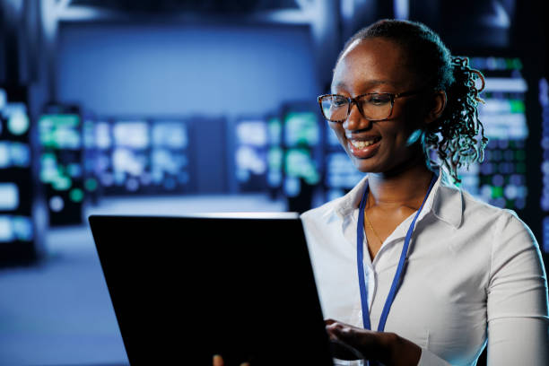 istock Woman in data center with laptop 1695500456
