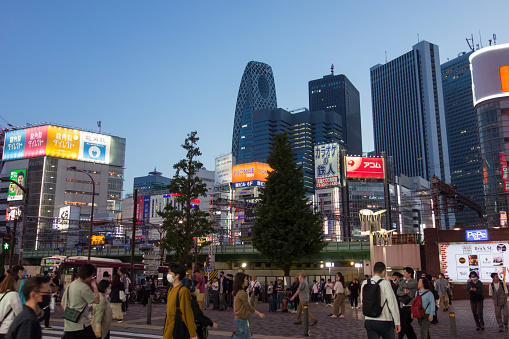 Tokyo, Japan, May 3, 2023: City street with pedestrians in Shinjuku town. Shinjuku is a special ward located in Tokyo Metropolis, Japan.