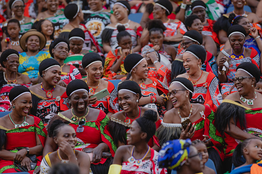 Seated during the Umhlanga Reed Dance are the married women, or mothers. They would have danced before the King when they were young girls. Happy, smiling faces enjoying the festivities.