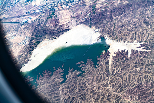 Looking land through airplane window