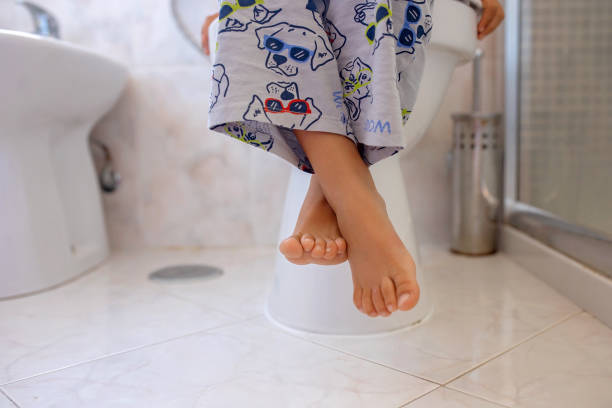 istock Cute child, boy, sitting on the toilet 1695521708