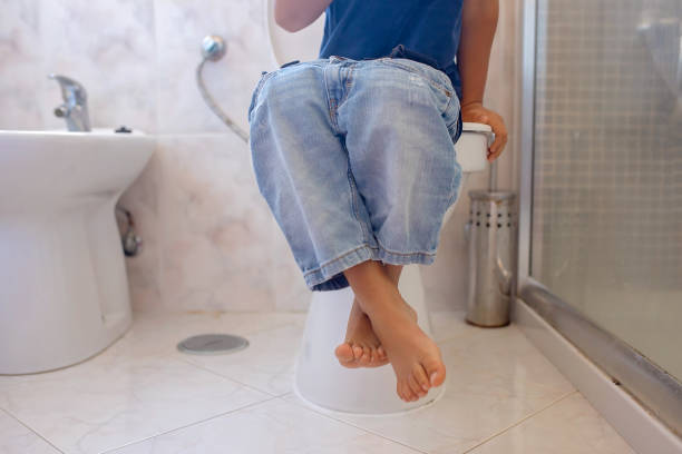 istock Cute child, boy, sitting on the toilet 1695521719