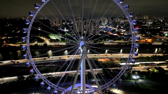 Night Scape at Sao Paulo Brazil. Major Ferris Wheel  Entertainment of Latin America at downtown Sao Paulo Brazil. Night Life at Ferris wheel at amusement park. Entertainment attraction.