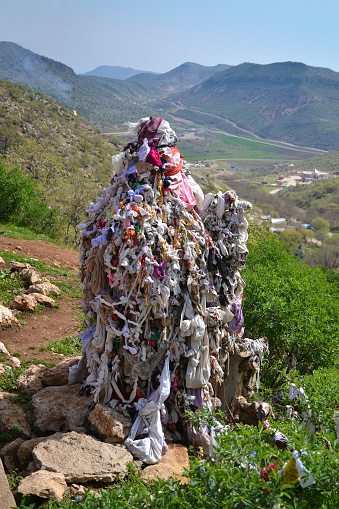 Lalish is an important Yazid holy site in Iraqi Kurdistan. A pile of knots made of colored fabrics, a knot means a closed wish, Iraq