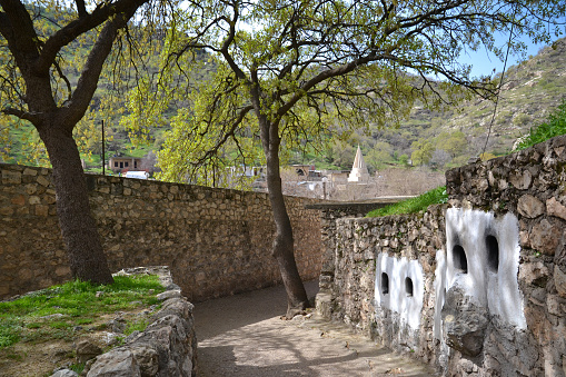Lalish is an important Yazid holy site in Iraqi Kurdistan. Aisle with niches in the walls for candles and lamps with oil, which will light up in the early evening.