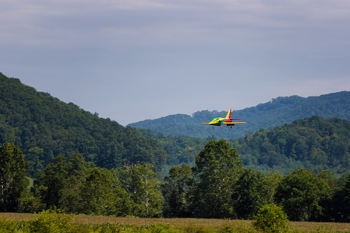 Mountain City, Tennessee: August 26, 2023: Radio Control jets doing take offs, aerobatic maneuvers and landings during the Jet Precision Aerobatic National Championship at Mountain City Airport in Tennessee.