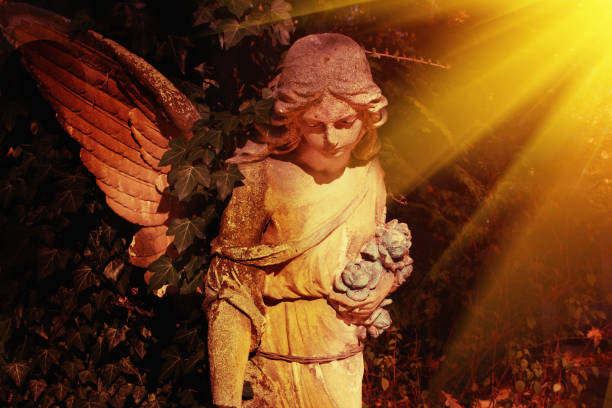 istock golden angel in the sunlight (antique statue) 1695569071