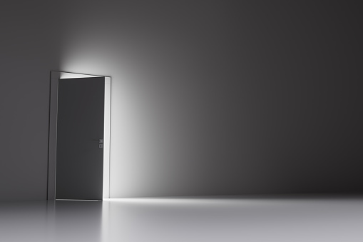 Conceptual 3D illustration of open door with glowing light into room.