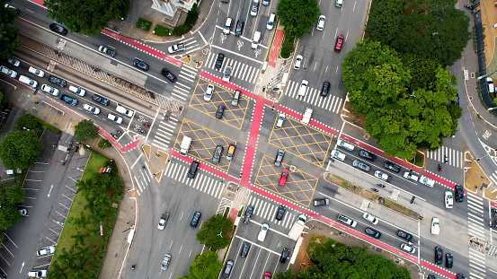 Top view famous crossing between Reboucas avenue and Brazil avenue at downtown Sao Paulo Brazil. Vehicles traffic at famous avenues at downtown Sao Paulo Brazil. Pedestrian crosswalk.