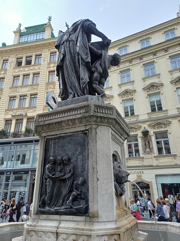 Vienna, Austria - June 8, 2023: Leopold Fountain (Leopoldsbrunnen) at Graben Street. Granite fountain basin with a bronze statue of Saint Leopold.
