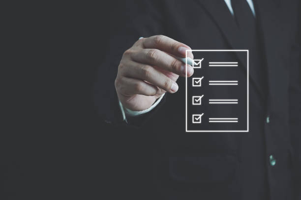 istock Business performance checklist, Quick checklist and clipboard management concept, job applicants, businessman using laptop doing online checklist survey,Employees must complete the online survey form. 1695591111