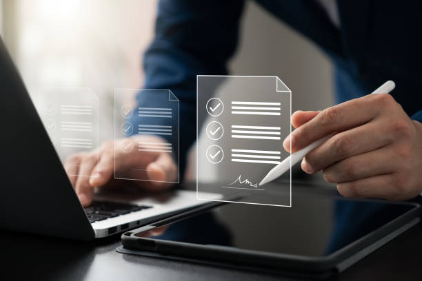 istock Electronic Signature Concept, Electronic Signing Businessman signs electronic documents on digital documents on virtual laptop screen using stylus pen. 1695595937