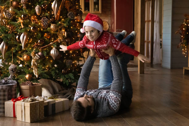 istock Happy young father playing with little kid son. 1695600802