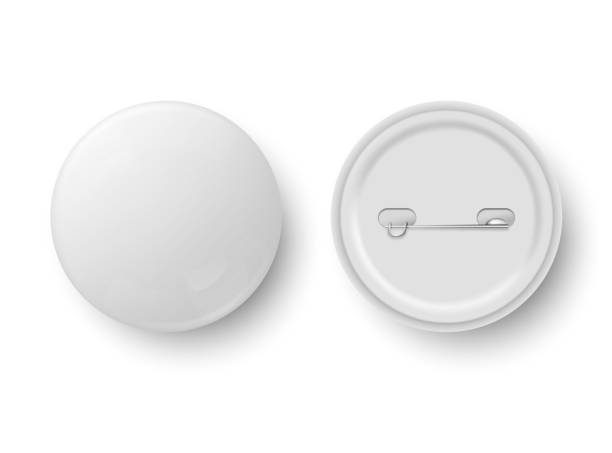 istock Blank button badge. White pinback badges, pin button and pinned back. Round metal buttons or glossy circle plastic 3D pin. Realistic isolated vector mockup. 1695609441