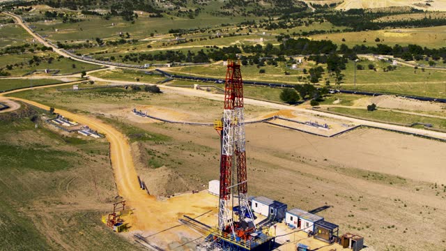 [Z05] Fracking drilling rig, industrial plant with factory  pipelines and storage tanks - Aerial View - ESG