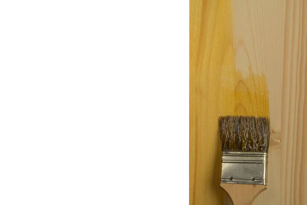 istock Painting a wooden surface with drying oil (varnish) 1695632970