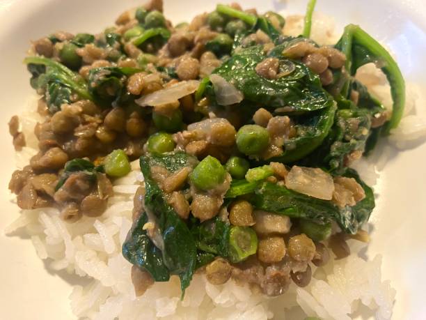 istock Lentils and spinach on rice with peas 1695648975