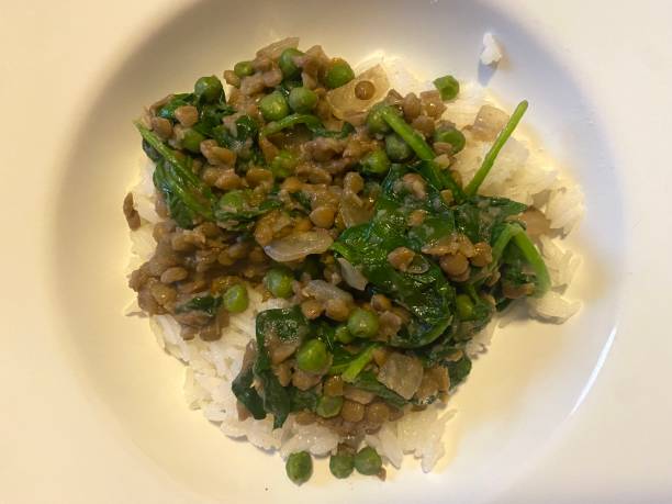 istock Lentils and spinach on rice with peas 1695648980