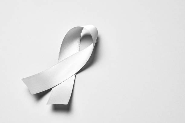 istock Lung cancer awareness ribbon background. 1695654034