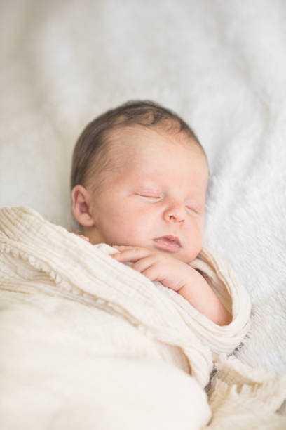 istock Cute baby sleeping 5 days old on light blanket. Banner design with space for text 1695669186