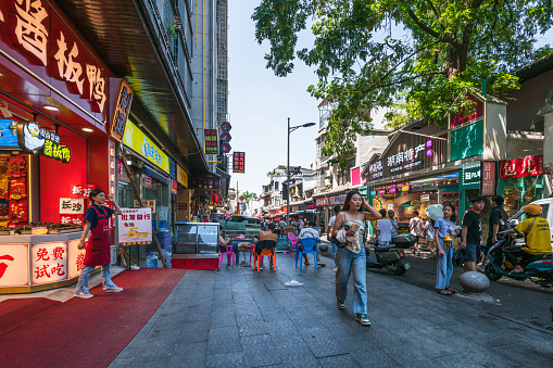 Changsha, China - September 1, 2023: Shops and cafes on pedestrian street