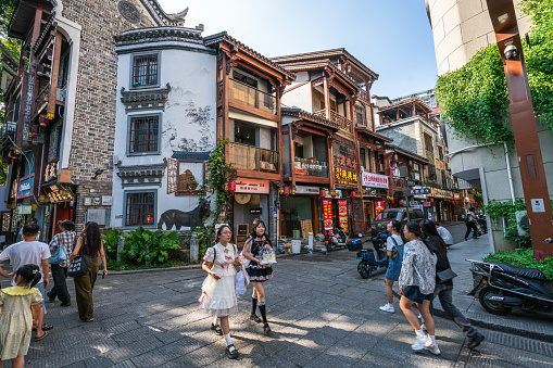 Changsha, China - September 1, 2023:  People walking in Food alley at Huangxing walking street