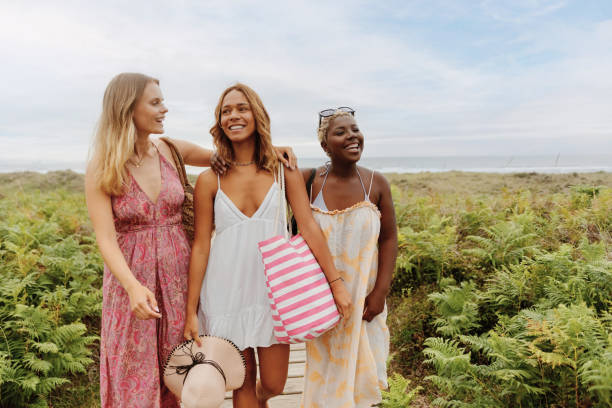 istock group of friends at the beach in summer 1695680367