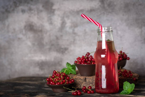 istock Red currants in small bowls and currant juice 1695708626
